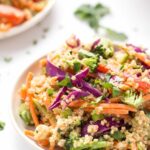 Bowl of Thai quinoa salad with veggies and almond butter dressing