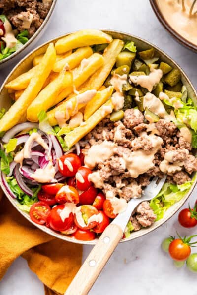 Burger bowl with fries and special sauce.