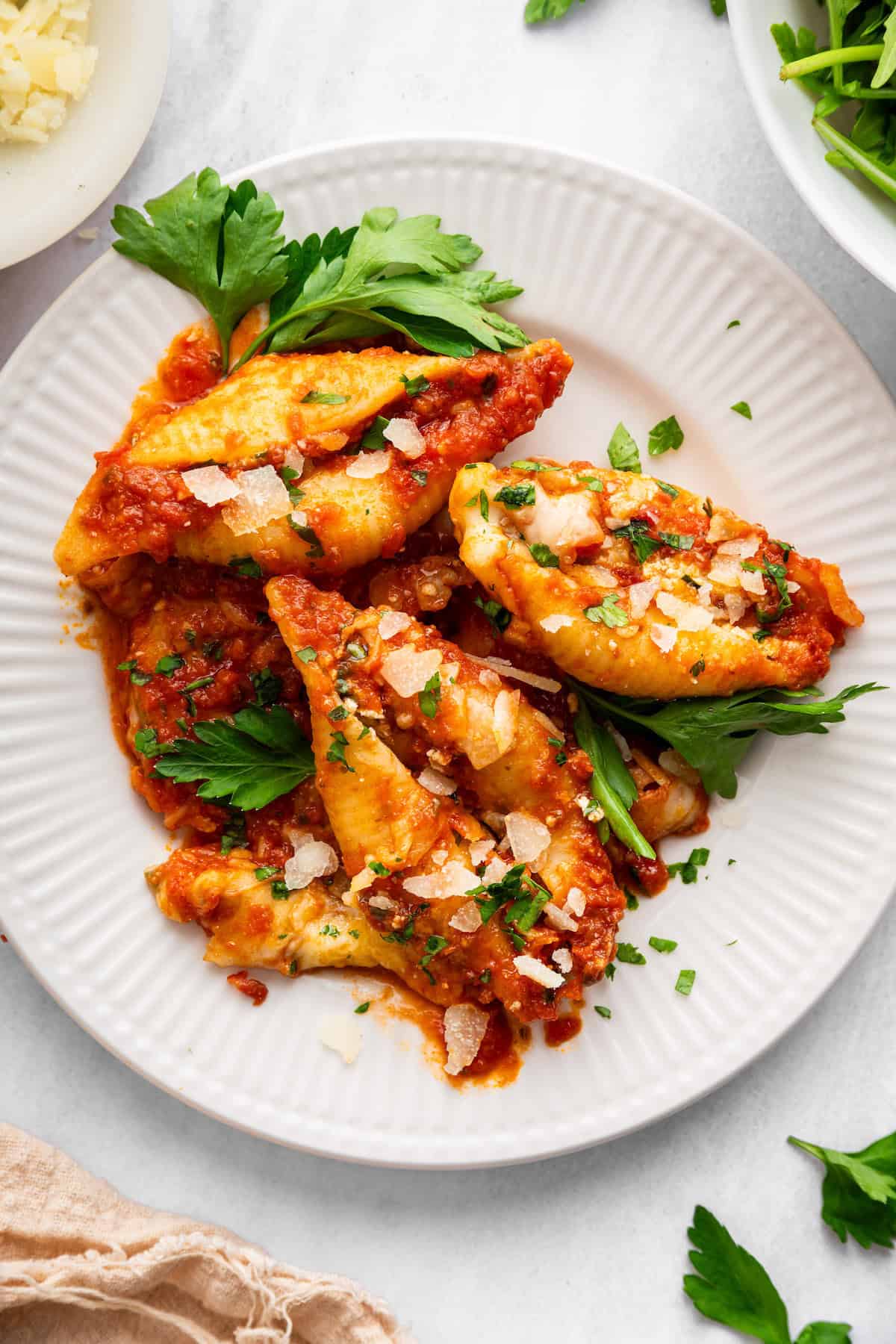 Plate of stuffed shells with spinach.