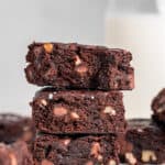 Stacked fudgy gluten-free vegan brownies.