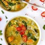Overhead view of two bowls of coconut curry lentil soup.