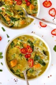 Overhead view of two bowls of coconut curry lentil soup.