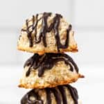 Stack of 3 quinoa coconut macaroons with chocolate drizzle