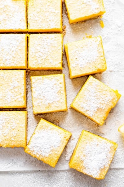 Slices of gluten-free lemon bars with powdered sugar on top.