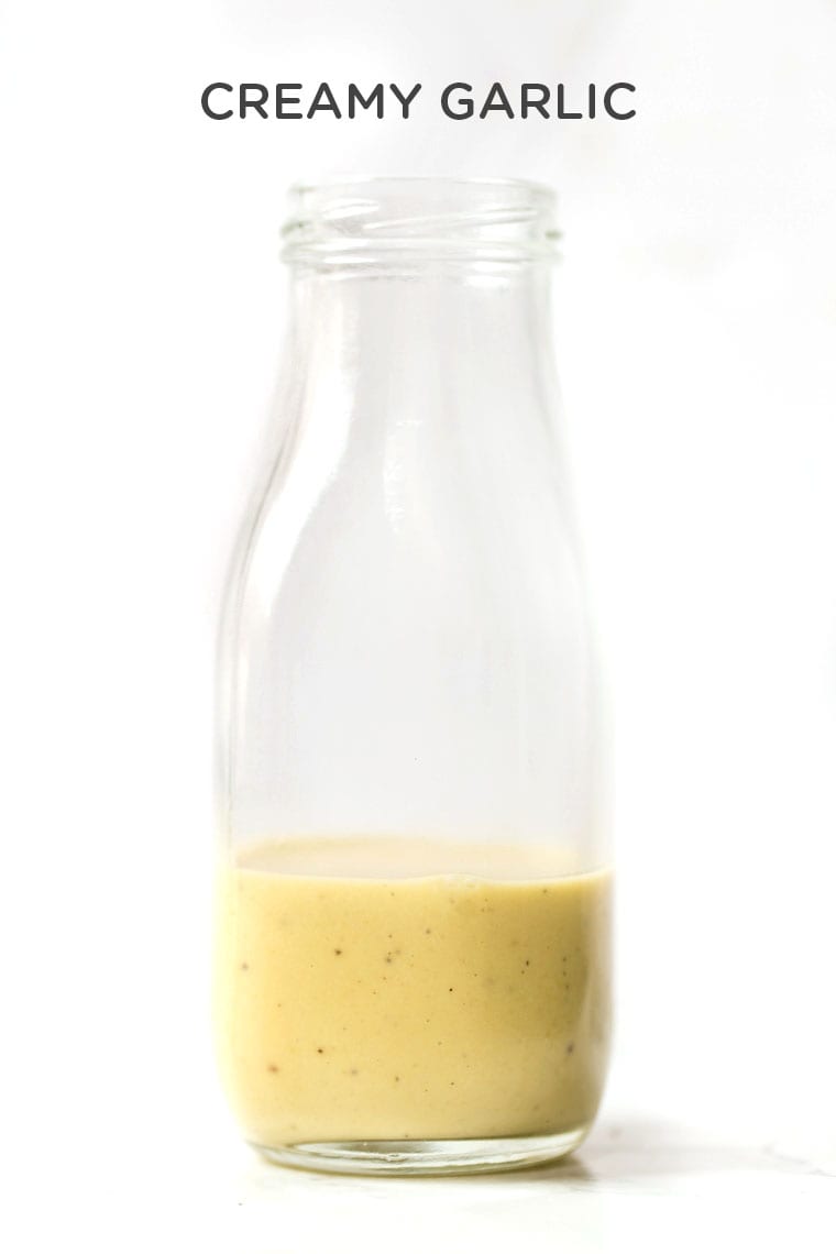 Vegan Creamy Garlic Dressing in glass bottle with text overlay