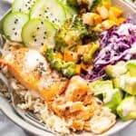 Top-down view of salmon power bowl with fork