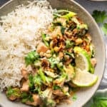 Salmon curry in bowl with white rice.