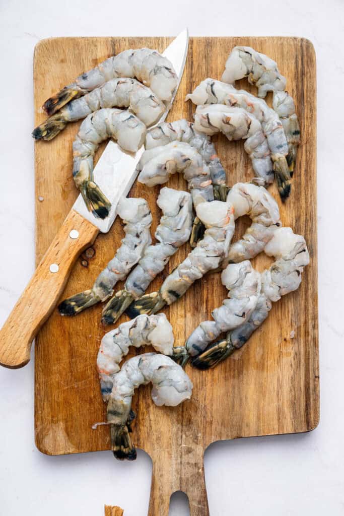 This crispy shrimp tempura is perfectly golden and just as crispy and delicious as the restaurant version. Only six ingredients! Shrimp on cutting board with knife