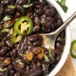 Spoonful of Instant Pot black beans set in bowl