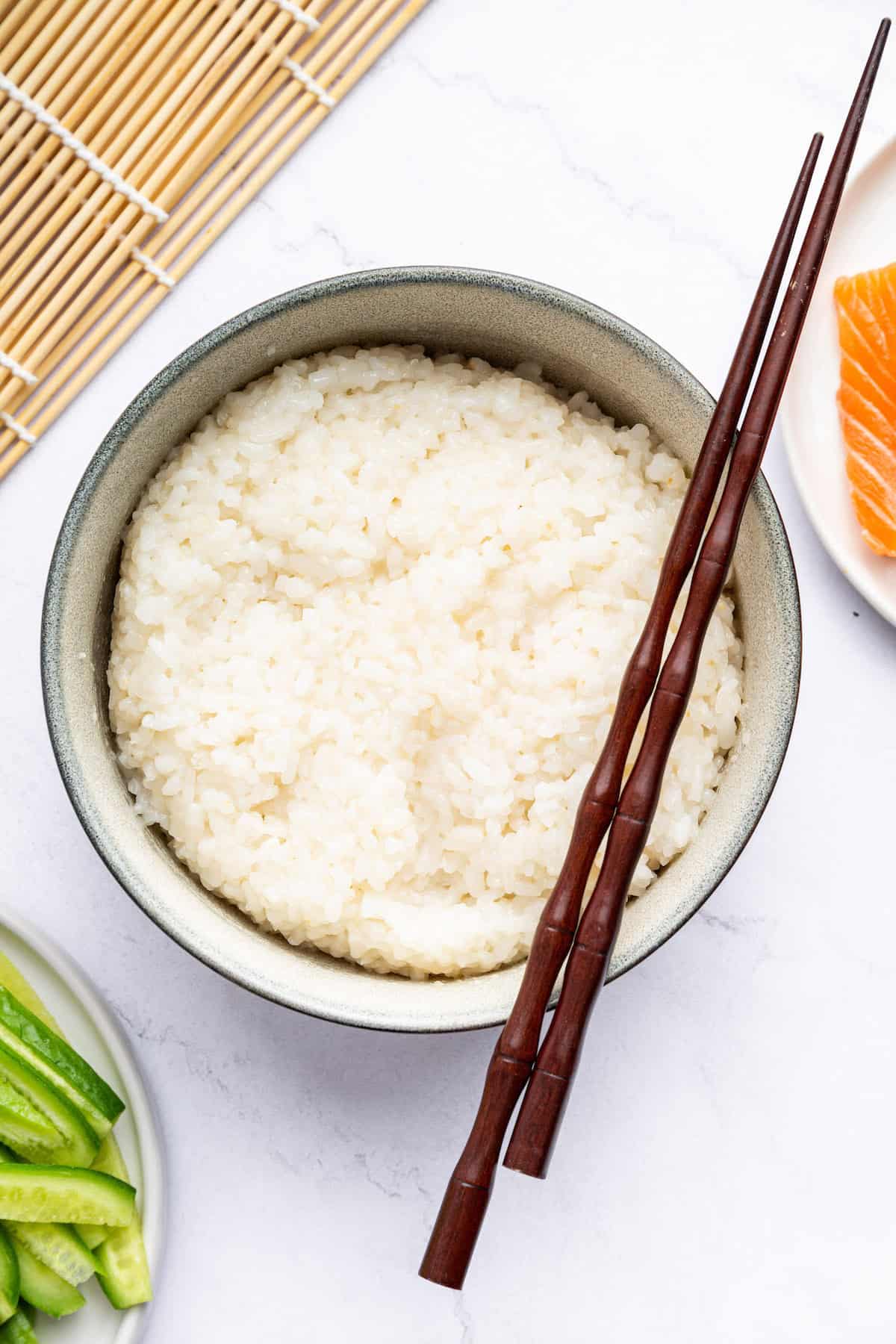 Overhead view of Instant Pot sushi rice in bowl with chopsticks