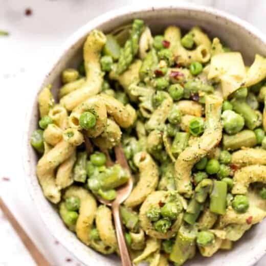 Overhead view of asparagus pasta in bowl with fork