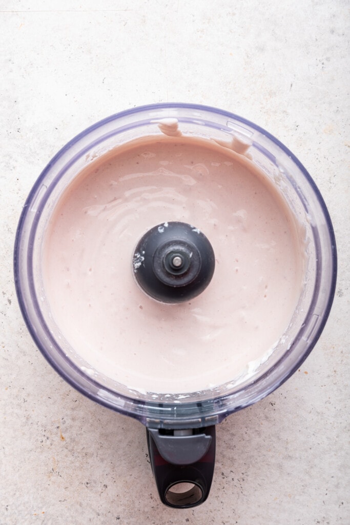 Love the protein but hate the curds? Whipped cottage cheese gives you the nutrition without the texture. Two easy versions: sweet & savory! Overhead view of whipped cottage cheese in food processor