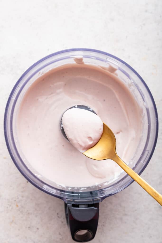 Love the protein but hate the curds? Whipped cottage cheese gives you the nutrition without the texture. Two easy versions: sweet & savory! Spoonful of whipped cottage cheese held over food processor