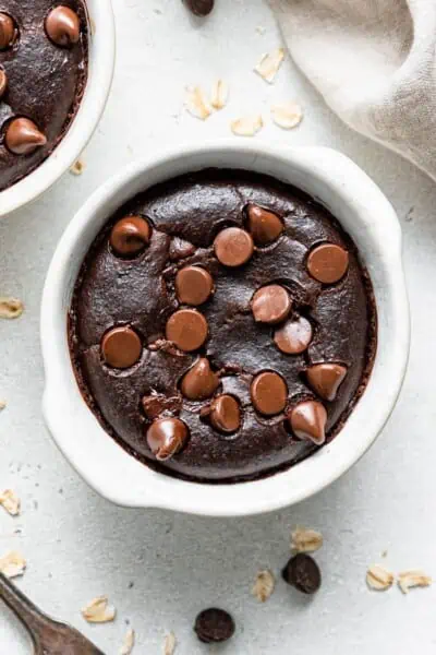 Overhead view of chocolate baked oatmeal in a ramekin.