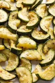 roasted zucchini on a baking sheet