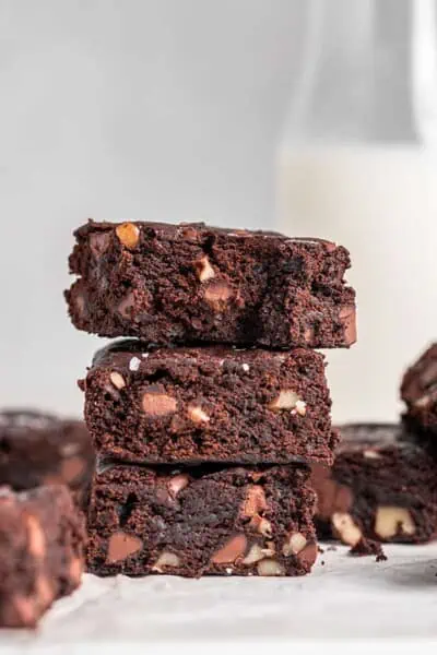 Stacked fudgy gluten-free vegan brownies.