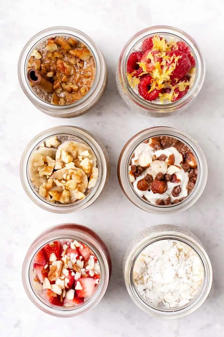 Learn to make chia seed pudding in 6 amazing flavors! These quick and easy recipes are great for breakfast or enjoy them as a balanced snack. Six jars with chia pudding in different flavors.