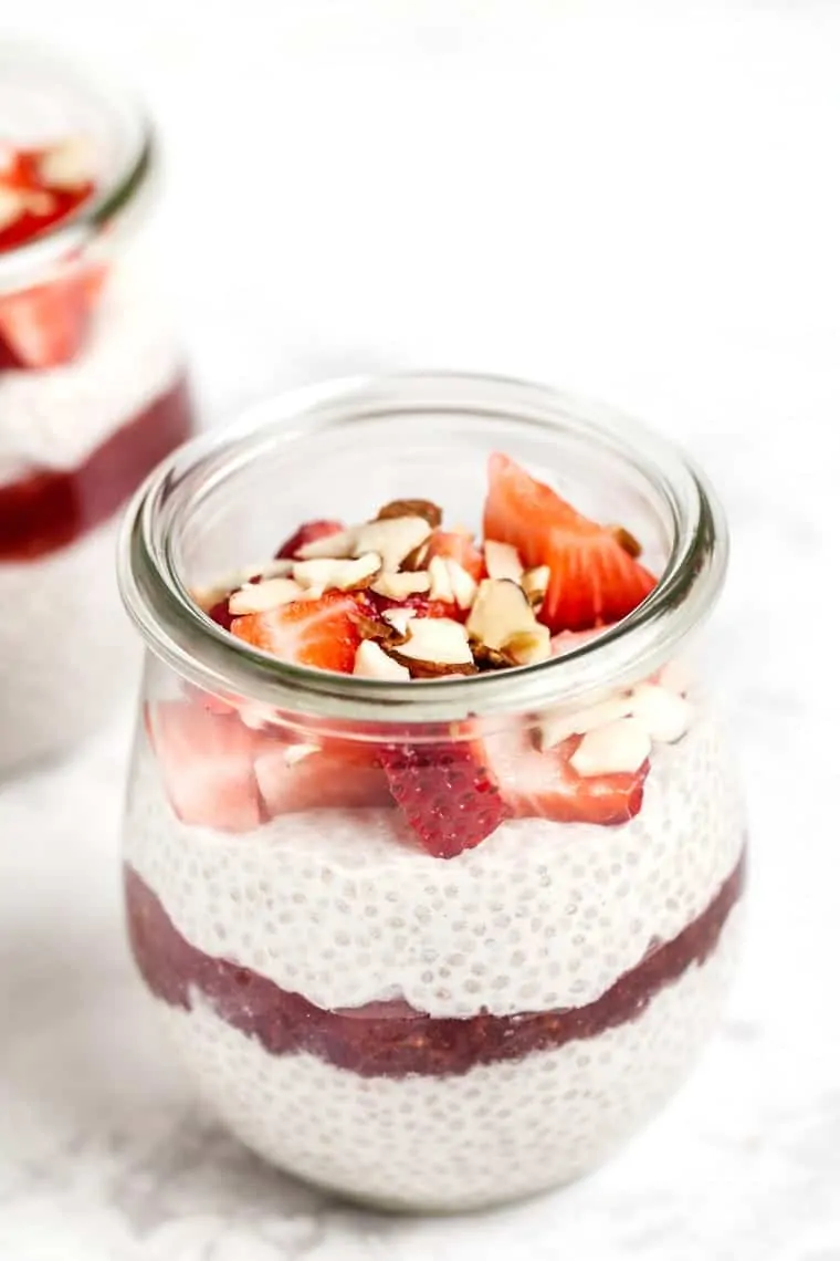 Learn to make chia seed pudding in 6 amazing flavors! These quick and easy recipes are great for breakfast or enjoy them as a balanced snack. Strawberry chia pudding in a jar.