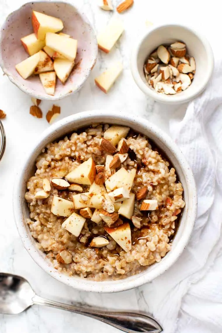 Learn how to make the creamiest steel-cut oats in the Instant Pot. This easy method works every time. Plus, get 6 flavor variations! Apple Cinnamon Steel Cut Oats