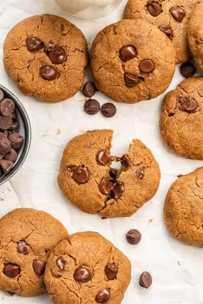 Overhead of vegan chocolate chip cookies on parchment paper.