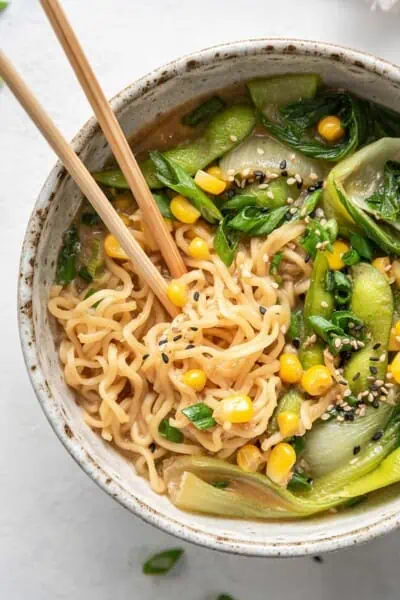 Close up vegan ramen in a bowl with chopsticks