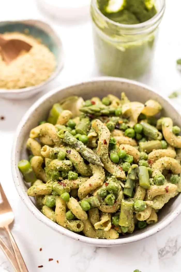 This one-pot asparagus pasta recipe is the best kind of weeknight dinner—easy and delicious! Pesto adds bright, fresh flavor. Top-down view of one-pot asparagus pasta recipe in bowl