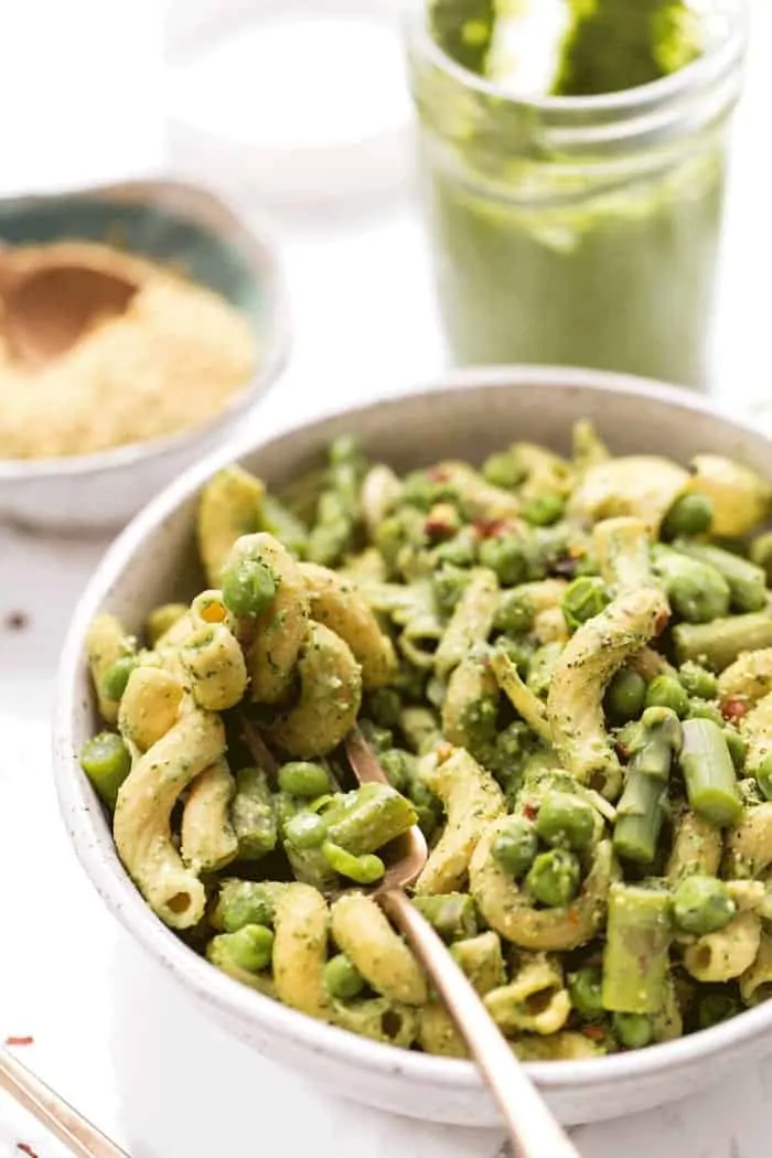 This one-pot asparagus pasta recipe is the best kind of weeknight dinner—easy and delicious! Pesto adds bright, fresh flavor. Bowl of creamy vegan asparagus pesto pasta